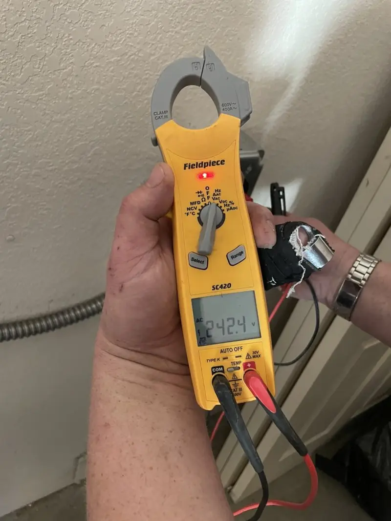 Voltage testing with clamp meter during Recessed Lighting Installation in Stoneham
